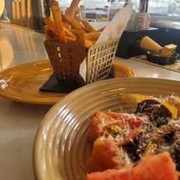 Beet salad with a side of fries.