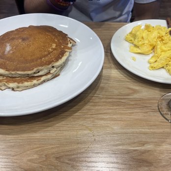 Broken Yolk Cafe - Half stack pancakes with scrambled eggs and bacon. - American Near Me - Glendora, California