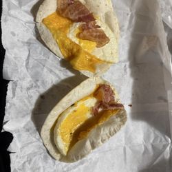 Dunkin' - What my wake up wraps looks likes one not even folded both wit not fully cooked bacon and the other one has 1 sad little piece