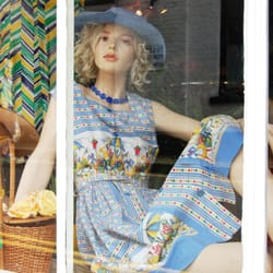kitts couture - Kittscouture shop window with pearl wearing a 1950's French cotton cafe scene print dress.