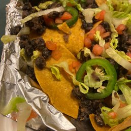 Shriveled up black beans with jalapeños dice tomato and lettuce Shriveled up black beans with jalapeños dice tomato and lettuce