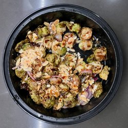 FINS Fish House & Raw Bar - Downtown Rehoboth - ROASTED BRUSSELS SPROUTS
Shaved pecorino parmesan, balsamic glaze, red onion, roasted almonds, goat cheese