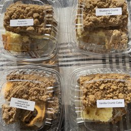 a close up of four containers of cake