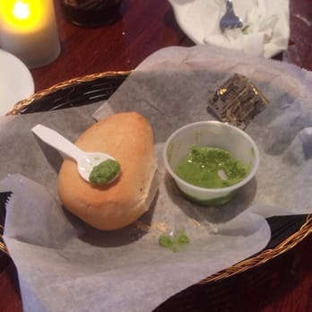 Chalan on the Beach - What was left of our bread. The green paste (idk what its called) was great! - Latin American Near Me - Miami Beach, Florida
