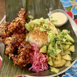 Mochi-Fried Chicken rice platter ($14.75 - Glutinous rice flour fried chicken, spicy adobo glaze, atchara, cucumber salad, Garlic Rice) Mochi-Fried Chicken rice platter ($14.75 - Glutinous rice flour fried chicken, spicy adobo glaze, atchara, cucumber salad, Garlic Rice)