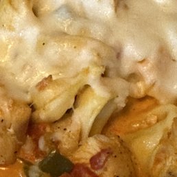 Three Cheese Tortellini with tomato sauce and chicken serve with a 1/2 toasted garlic hoagie bread piece. Three Cheese Tortellini with tomato sauce and chicken serve with a 1/2 toasted garlic hoagie bread piece.