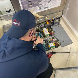 Hotwire HVAC Refrigeration & Appliance Repair - Commercial Dishwasher Repair.
Hotwire working on complex electronics inside a commercial dish machine.