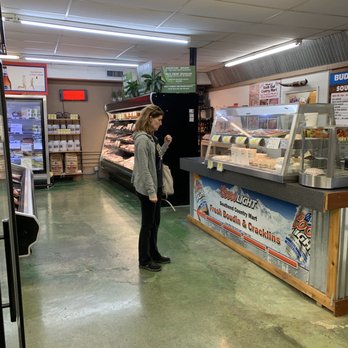 South-End Country Mart - a woman standing in front of a counter - Grocery Near Me - Lafayette, Louisiana South-End Country Mart - a woman standing in front of a counter - Grocery Near Me - Lafayette, Louisiana