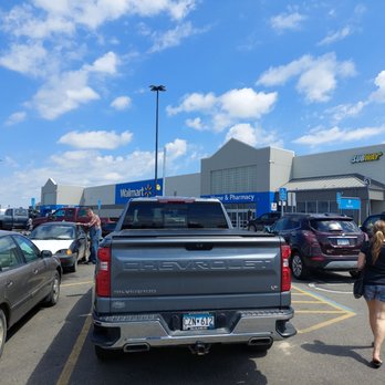 Walmart Supercenter - a woman walking in a parking lot - Department Stores Near Me - Bemidji, Minnesota