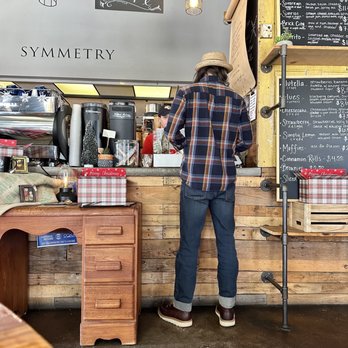 Symmetry Coffee Company - a man standing at the counter - Creperies Near Me - Ocala, Florida