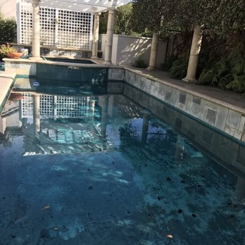 Platinum Pool Company - Before demo, old mottled colored plaster - Pool & Hot Tub Service Near Me