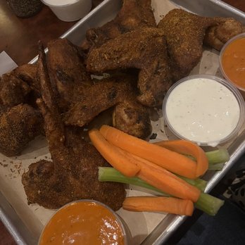 Fat Heads Saloon - smoked wings with cajun ranch dry rub and some sides of extra medium sauce - Chicken Wings Near Me - Pittsburgh, Pennsylvania Fat Heads Saloon - smoked wings with cajun ranch dry rub and some sides of extra medium sauce - Chicken Wings Near Me - Pittsburgh, Pennsylvania