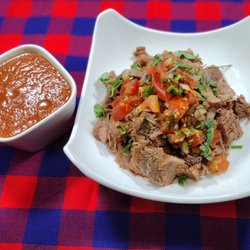 Mara Mara BBQ - BBQ Goat and Kachumbari BBQ Goat smoked until falling off the bone and juicy. seasoned with Kenyan spices and served with Kachumbari salsa.