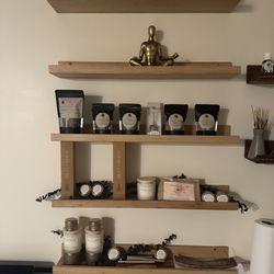 Massage Health and Contour Center - MHCC Wellness wall with medicinal herbs, soy-free candles, incenses and more for anti-inflammatory tea, hormone balance, fall scents.