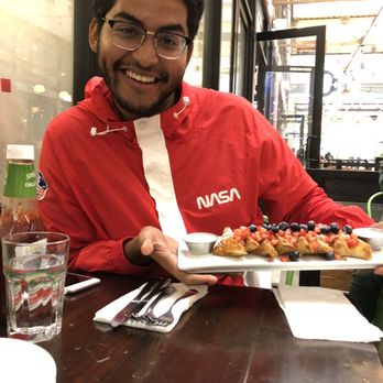 Blu Jam Cafe - My best friend happily holding the Crunchy French Toast! - Breakfast & Brunch Near Me - Los Angeles, California