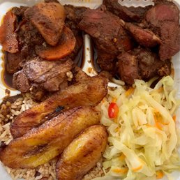 meat, rice and vegetables in a styrofoam container