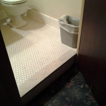 The Faust Hotel - The large step separating the bathroom from the rest of the room. - Hotels Near Me - New Braunfels, Texas