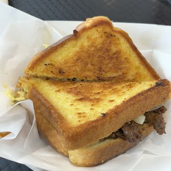 Aunt Tina’s Kitchen - "A minor" ribeye sandwich: marinated ribeye and grilled onions on garlic Texas toast with garlic aioli.  Delicious!  Fast too!!! - Southern Near Me - Elmhurst, Illinois