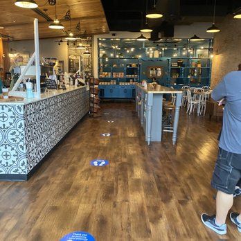 Summer Moon Coffee - a man standing in a coffee shop - Coffee & Tea Near Me - Kyle, Texas