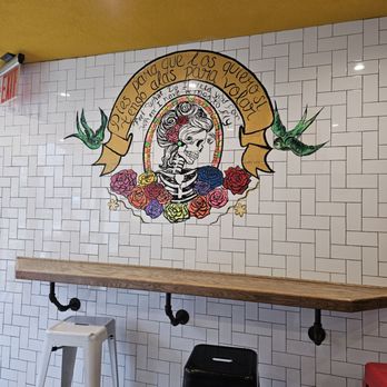 Sidewalk Tacos - a mural of a skull and roses - Food Trucks Near Me - New York, New York Sidewalk Tacos - a mural of a skull and roses - Food Trucks Near Me - New York, New York