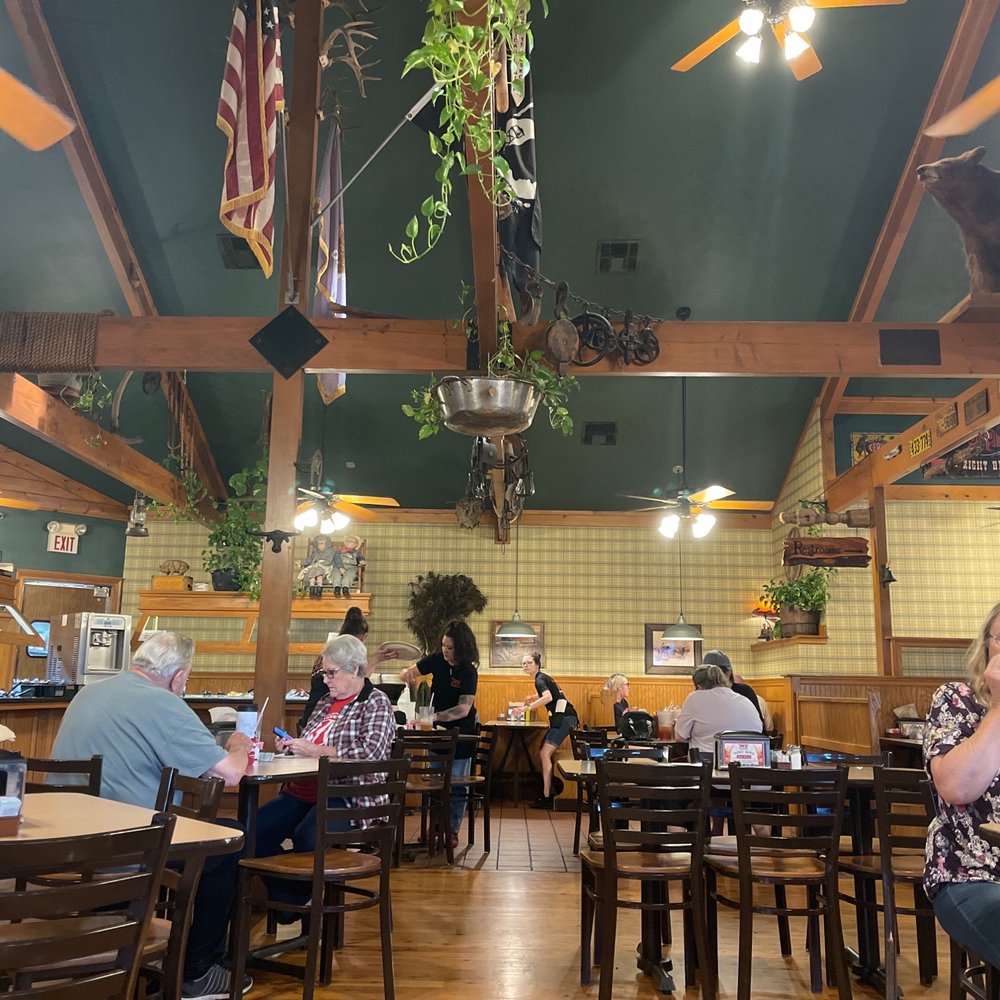 People enjoying the food, very well decor. People enjoying the food, very well decor.