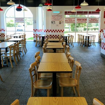Five Guys - tables and chairs in a restaurant - Burgers Near Me - Zephyrhills, Florida