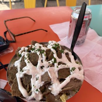 Moab Food Truck Park - Gyro laced with creamy tzatziki sauce over lettuce, tomatoes, onions and cucumber. - Food Court Near Me - Moab, Utah Moab Food Truck Park - Gyro laced with creamy tzatziki sauce over lettuce, tomatoes, onions and cucumber. - Food Court Near Me - Moab, Utah