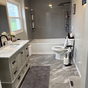 Triple Check Construction - Bathroom remodel features a 7 foot long, Kohler soaking tub with Onyx shower, new vanities, toilet mirror and flooring, and lighting - General Contractors Near Me - Atchison, Kansas Triple Check Construction - Bathroom remodel features a 7 foot long, Kohler soaking tub with Onyx shower, new vanities, toilet mirror and flooring, and lighting - General Contractors Near Me - Atchison, Kansas