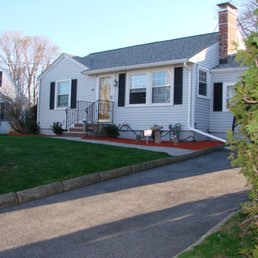 a white house with black shutters