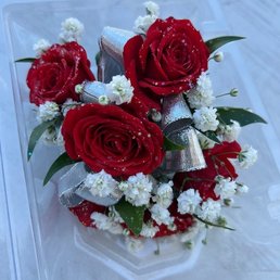 Mini red rose corsage, silver ribbon