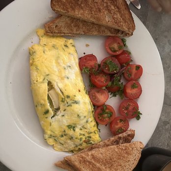 George's Place - Herb and Brie omlette with tomatoes on the side instead of hash browns - Breakfast & Brunch Near Me - Cape May, New Jersey George's Place - Herb and Brie omlette with tomatoes on the side instead of hash browns - Breakfast & Brunch Near Me - Cape May, New Jersey