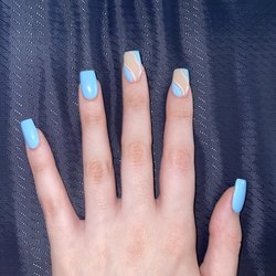 Mini Sky Nails - Short blue acrylic nails with a squiggly pattern on two nails