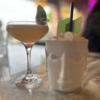 Calle Dragones - One of the classics (left); Eleggua (right) - Cuban Near Me - Miami, Florida