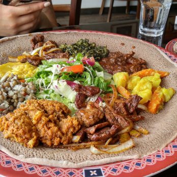 Lucy Ethiopian Restaurant - Meat and veggie platter. - Ethiopian Near Me - Toronto, Ontario Lucy Ethiopian Restaurant - Meat and veggie platter. - Ethiopian Near Me - Toronto, Ontario