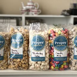 five bags of popcorn on a counter five bags of popcorn on a counter