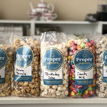 Proper Popcorn - five bags of popcorn on a counter - Popcorn Shops Near Me - Knoxville, Tennessee Proper Popcorn - five bags of popcorn on a counter - Popcorn Shops Near Me - Knoxville, Tennessee
