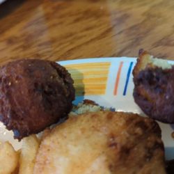 Dock House Seafood & More - Burnt hush puppies. Totally oil burnt like the oil has never been changed out of their fryer.