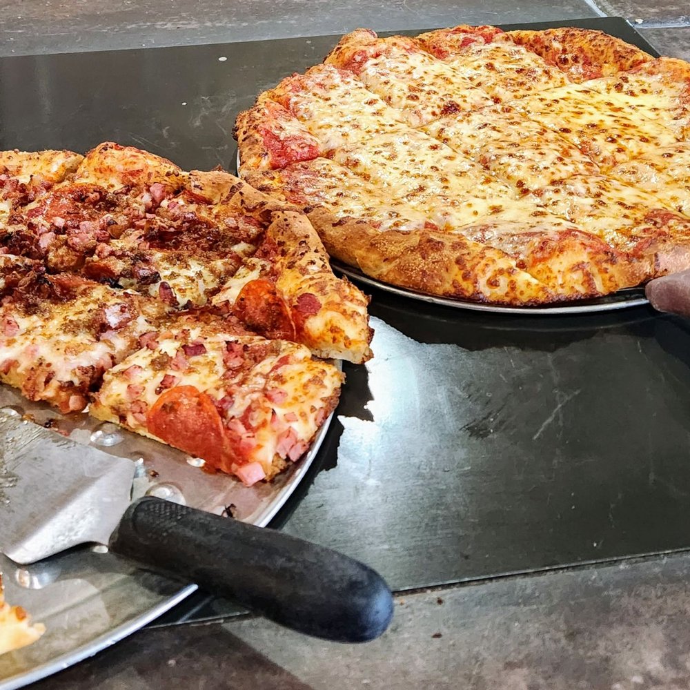 Giovanni's Pizza - two pizzas and a pizza cutter - Pizza Near Me - Hillsboro, Ohio Giovanni's Pizza - two pizzas and a pizza cutter - Pizza Near Me - Hillsboro, Ohio