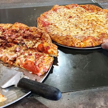 Giovanni's Pizza - two pizzas and a pizza cutter - Pizza Near Me - Hillsboro, Ohio