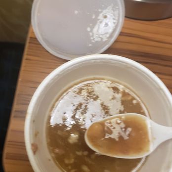Ray's Place - a bowl of soup with a spoon in it - Bars Near Me - Eau Claire, Wisconsin