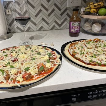 Vinnola's Italian Market - two pizzas on a counter - Italian Near Me - Wheat Ridge, Colorado Vinnola's Italian Market - two pizzas on a counter - Italian Near Me - Wheat Ridge, Colorado