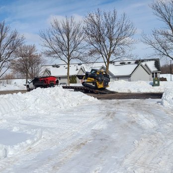Waconia Landscaping - a snow plow clearing a driveway - Snow Removal Near Me - Waconia, Minnesota Waconia Landscaping - a snow plow clearing a driveway - Snow Removal Near Me - Waconia, Minnesota