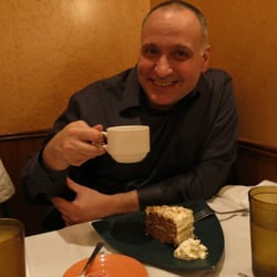 Yee Medicine And Pediatric Associates - Dr. Psalidas @ 2013's Christmas dinner enjoying a cup of coffee.