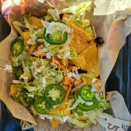 Blacked chicken nacho. With lettuce, light sour cream, cold cheese. Blacked chicken nacho. With lettuce, light sour cream, cold cheese.