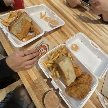 Raising Cane's Chicken Fingers - two trays of fried chicken and french fries - Fast Food Near Me - Charlottesville, Virginia
