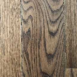 Large gaps between boards, attempted to fill in with mis-colored wood putty