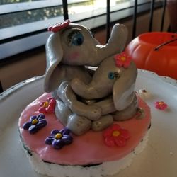 Dragonfly Specialty Cakes & more - Who doesn't love cute elephants? Very cool hand formed topper.