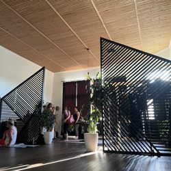 The inside of the Yoga studio, love the wooden entrance borders