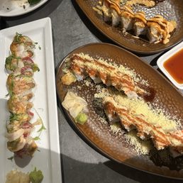 Our delicious rolls pictured are, aguachile, crunchy roll and super crunchy roll with lobster salad