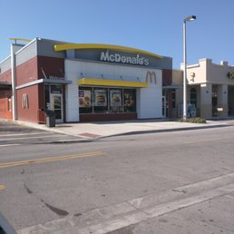 a mcdonald's on the corner of a street